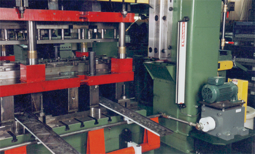 Conveyors removing scrap from a press