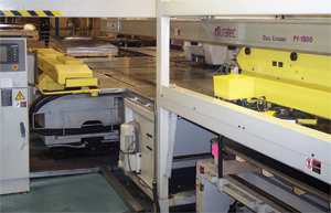 Automated material loand and unload equipment on three of its six CNC turret presses