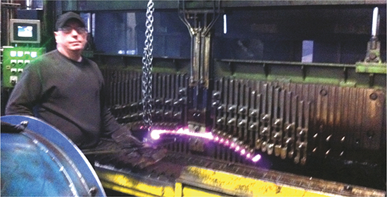 forming head establishes the bend in the leaf spring