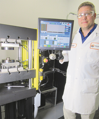 Scott Lay inspects advanced high strength steel cup