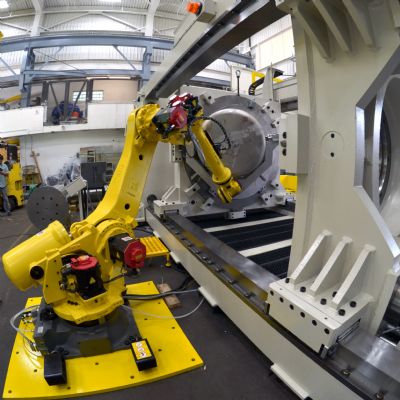 Teaming Hydraulic Presses with Robots