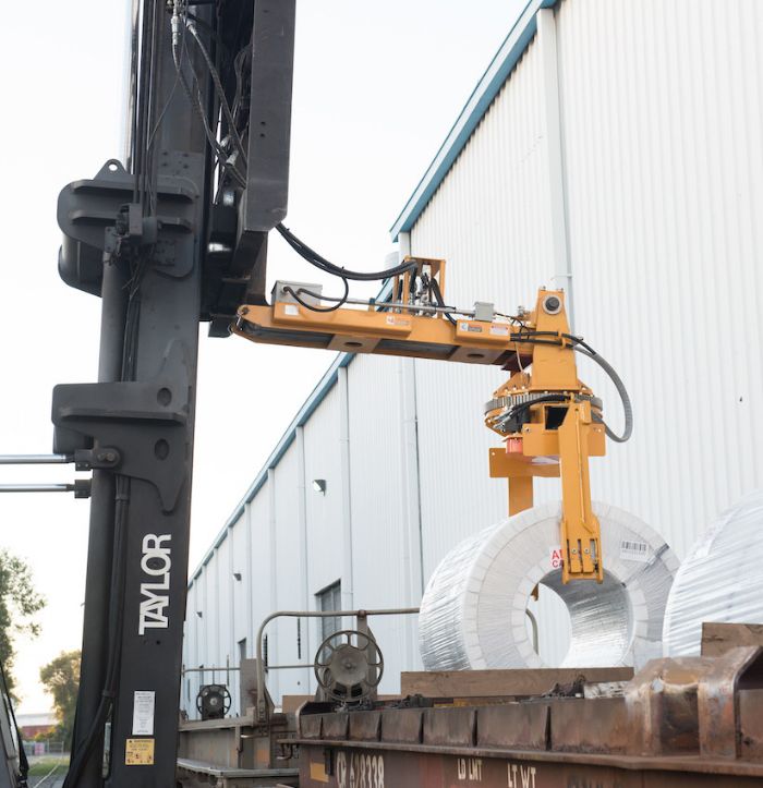 Custom Forklift Attachment Unloads Coils at Stamping Plant