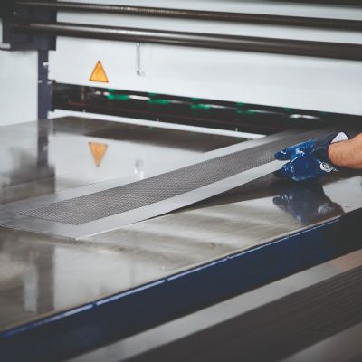 Precision Leveler Helps Give Perforated Sheets a Captiv...