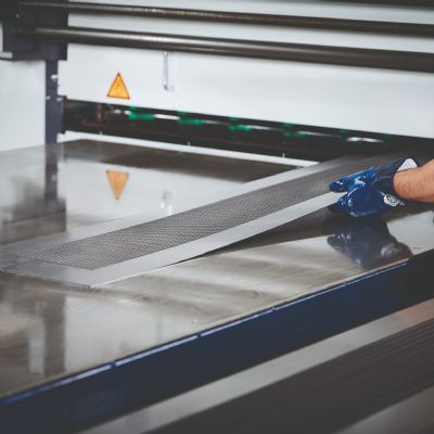 Precision Leveler Helps Give Perforated Sheets a C...